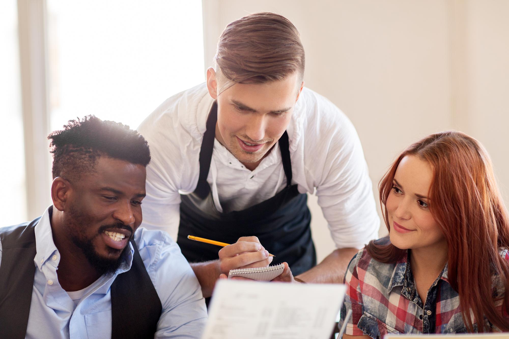Chef and proprietor reviewing menu documents