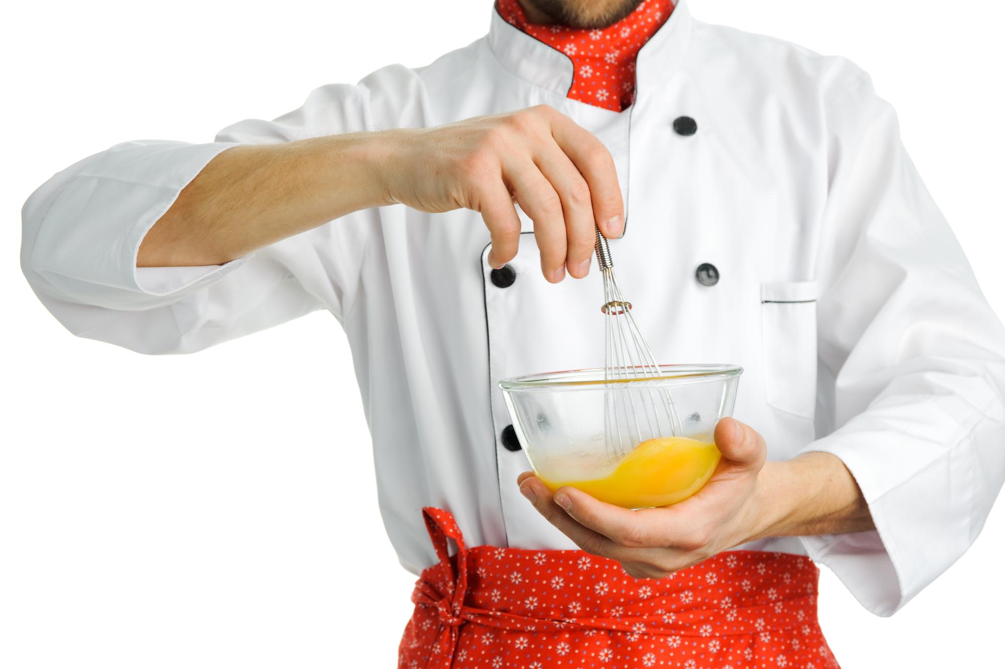 Instructor demonstrating sauce technique to small group